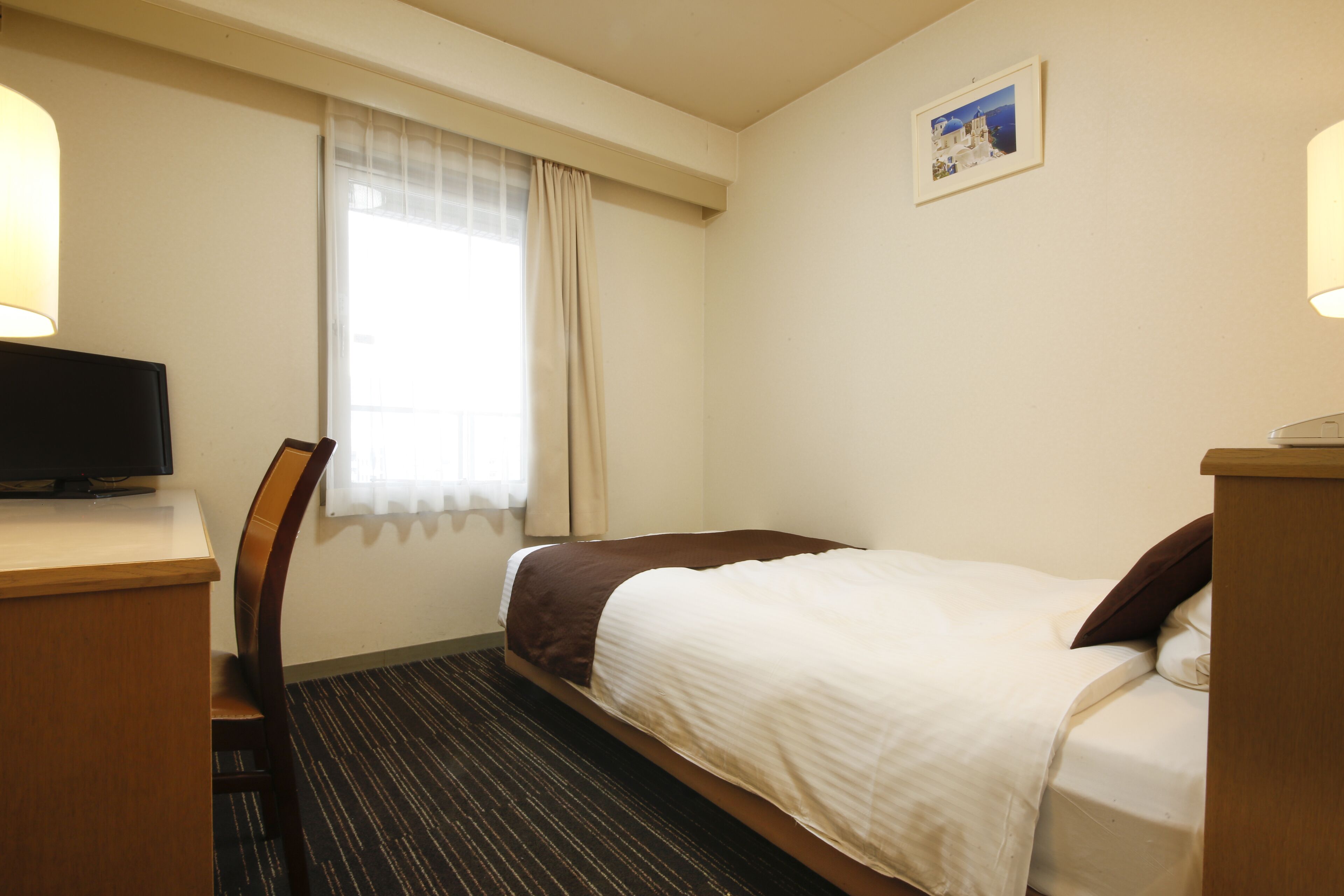 economy single room, 1 bedroom, smoking | down duvets, desk, blackout curtains, iron/ironing board