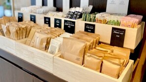 A display of various packaged products in a store, including body towels and other items. - Shin Osaka Sunny Stone Hotel (Osaka)
