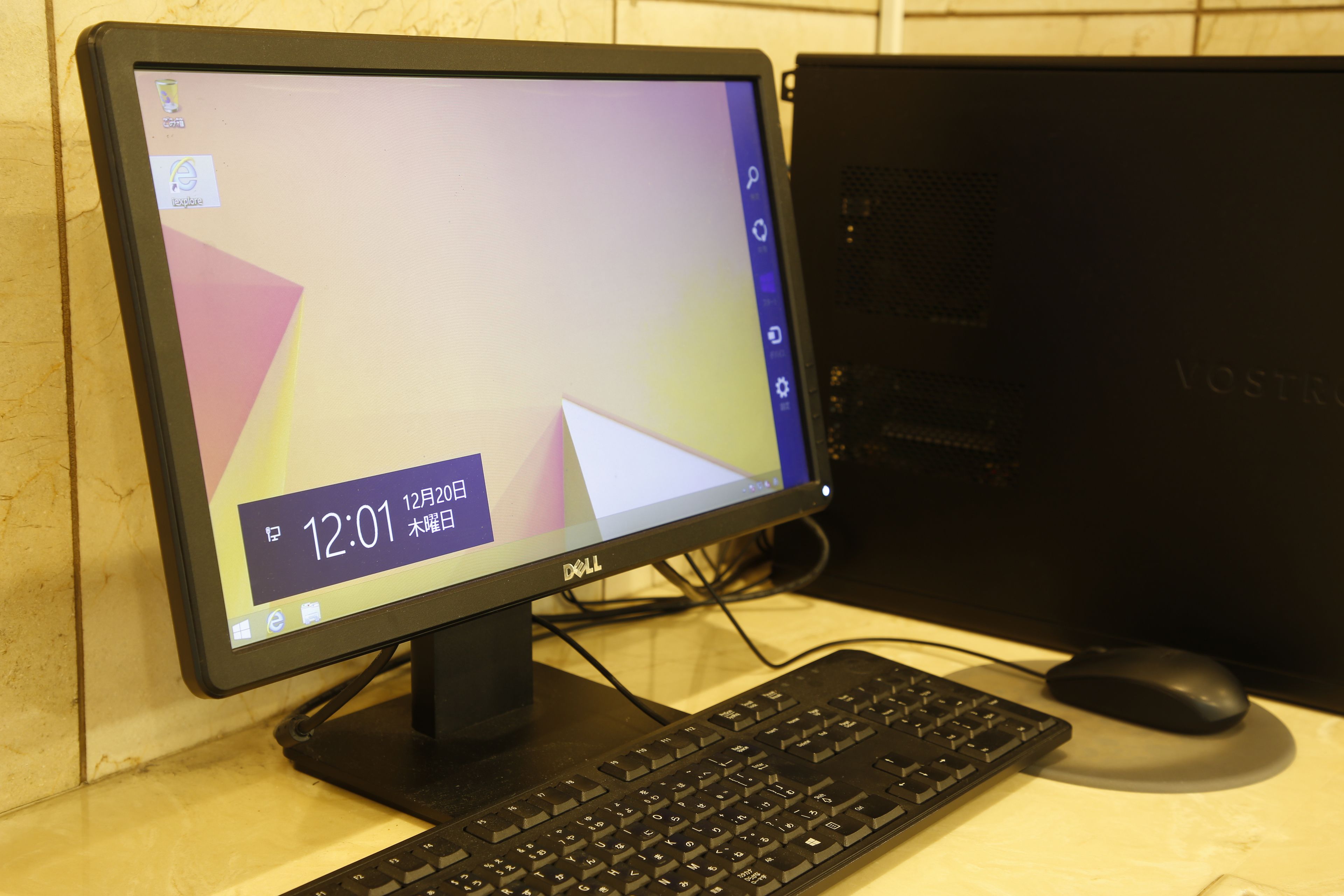 A desktop computer with a monitor, keyboard, and mouse on a desk.