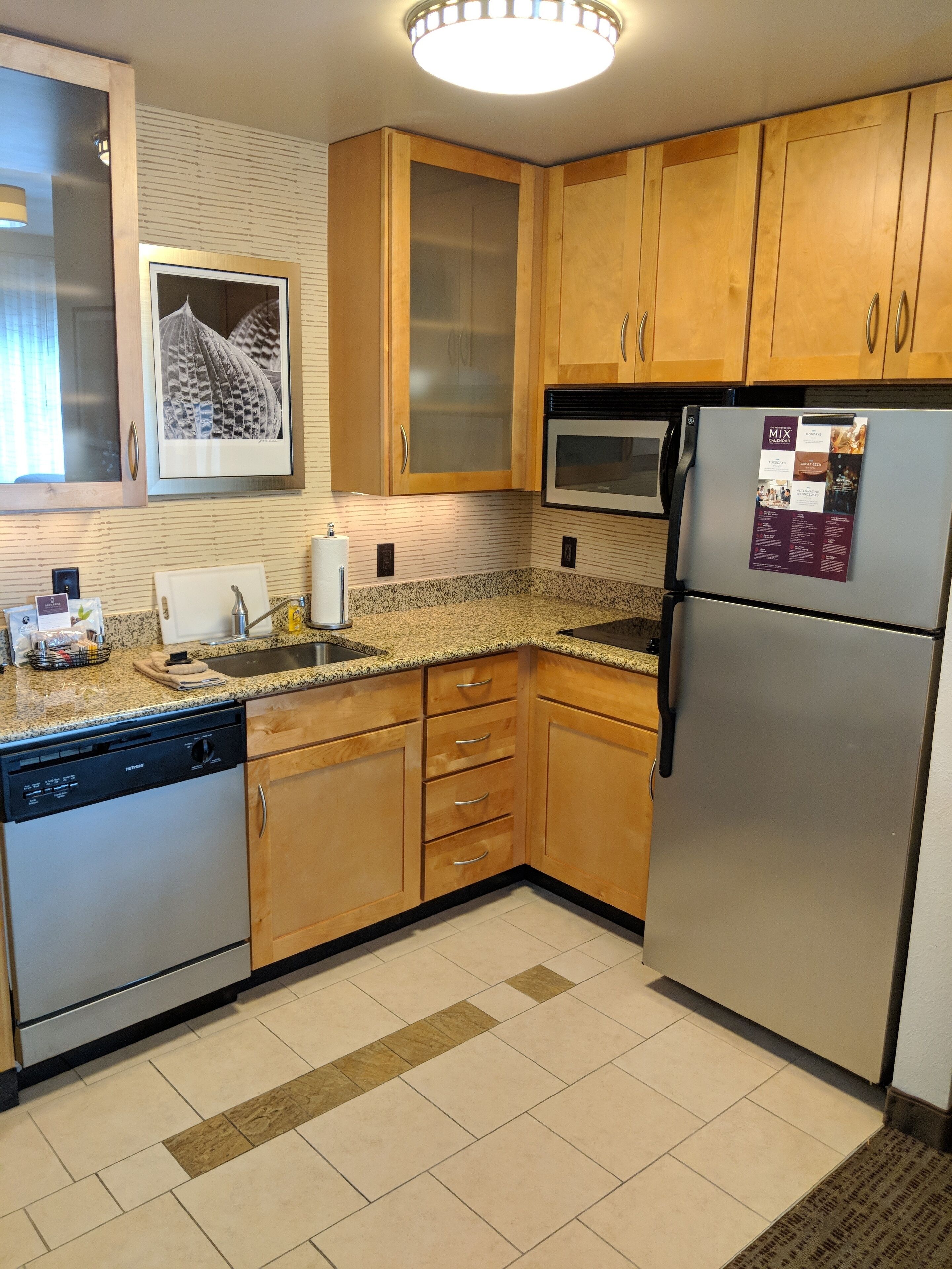 full-sized fridge, microwave, stovetop, dishwasher