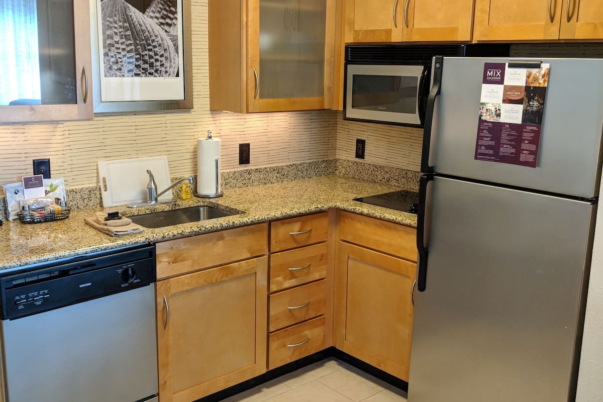 full-sized fridge, microwave, stovetop, dishwasher