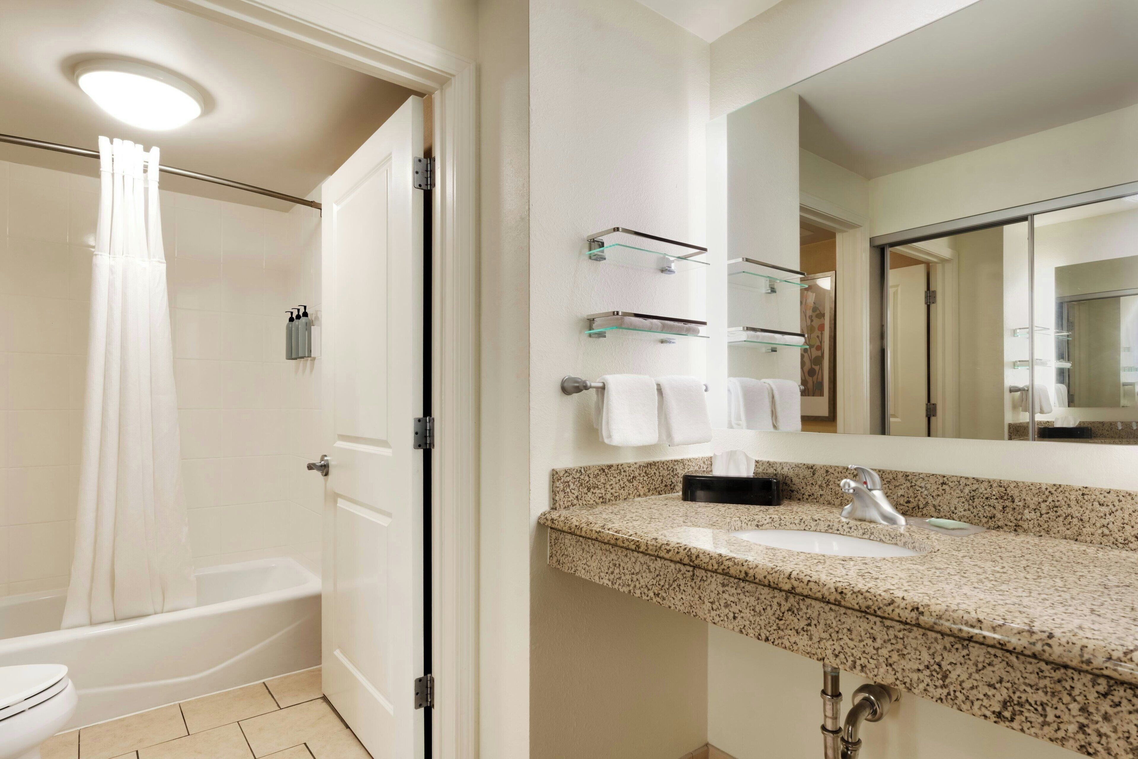 suite, 2 bedrooms | bathroom | combined shower/bathtub, designer toiletries, hair dryer, towels