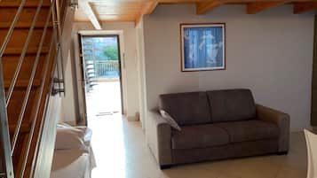 Deluxe Studio, 1 Double Bed with Sofa bed | Living room | Flat-screen TV