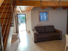 Deluxe Studio, 1 Double Bed with Sofa bed | Living room | Flat-screen TV