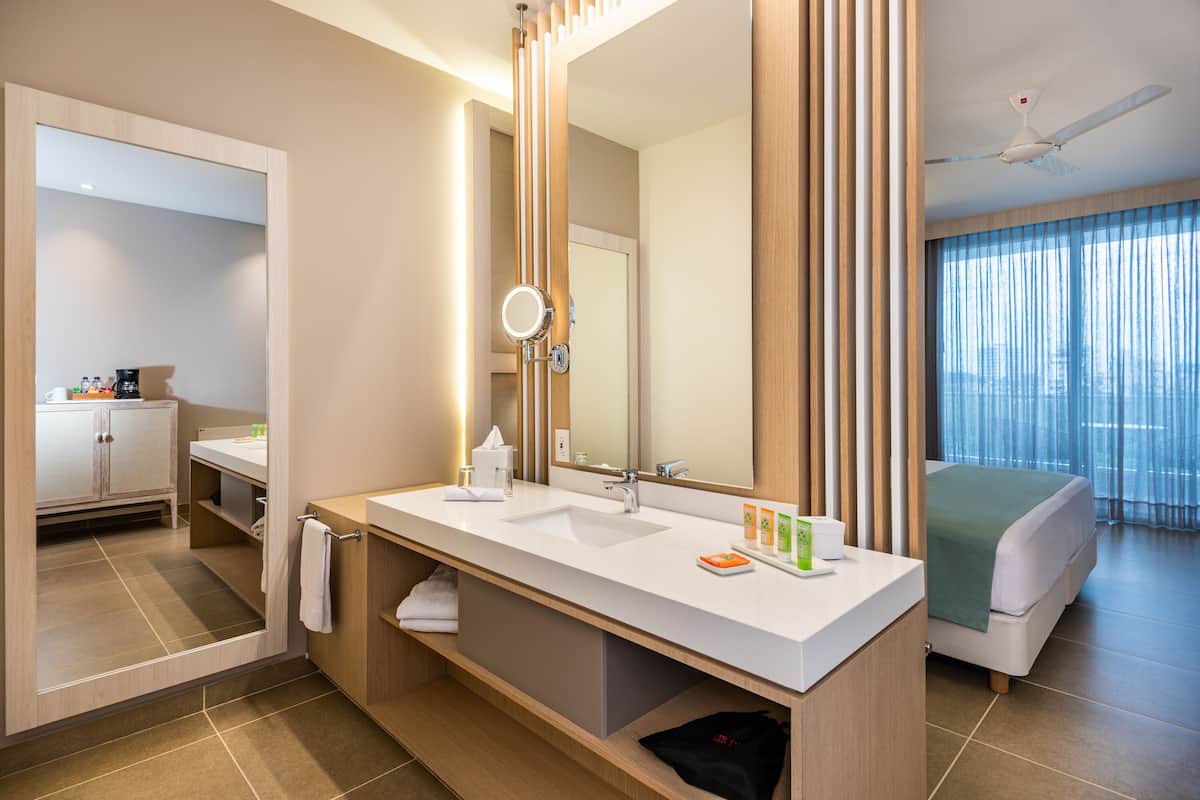 superior room | bathroom | shower, rainfall showerhead, designer toiletries, hair dryer