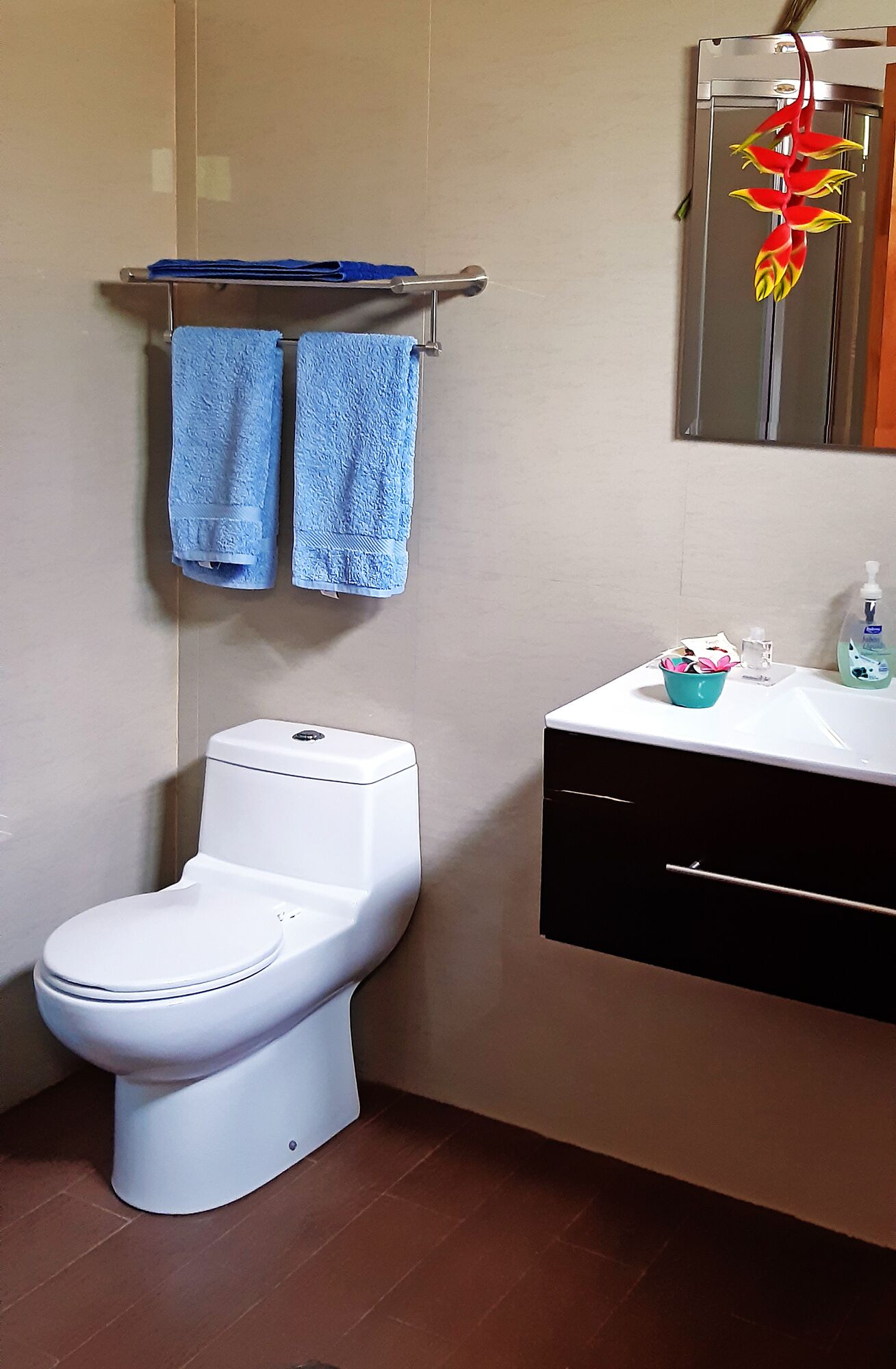 family room | bathroom | shower, rainfall showerhead, hair dryer, towels