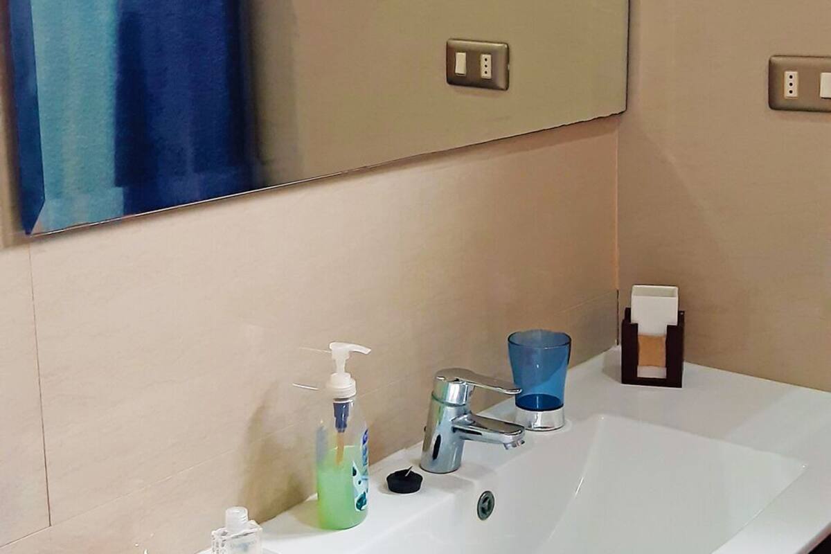 family room | bathroom | shower, rainfall showerhead, hair dryer, towels