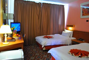 Double or Twin Room | Minibar, in-room safe, desk, blackout drapes