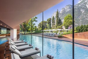Indoor pool, outdoor pool, pool umbrellas, pool loungers
