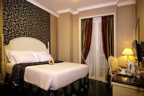 Premium bedding, free minibar items, in-room safe, desk