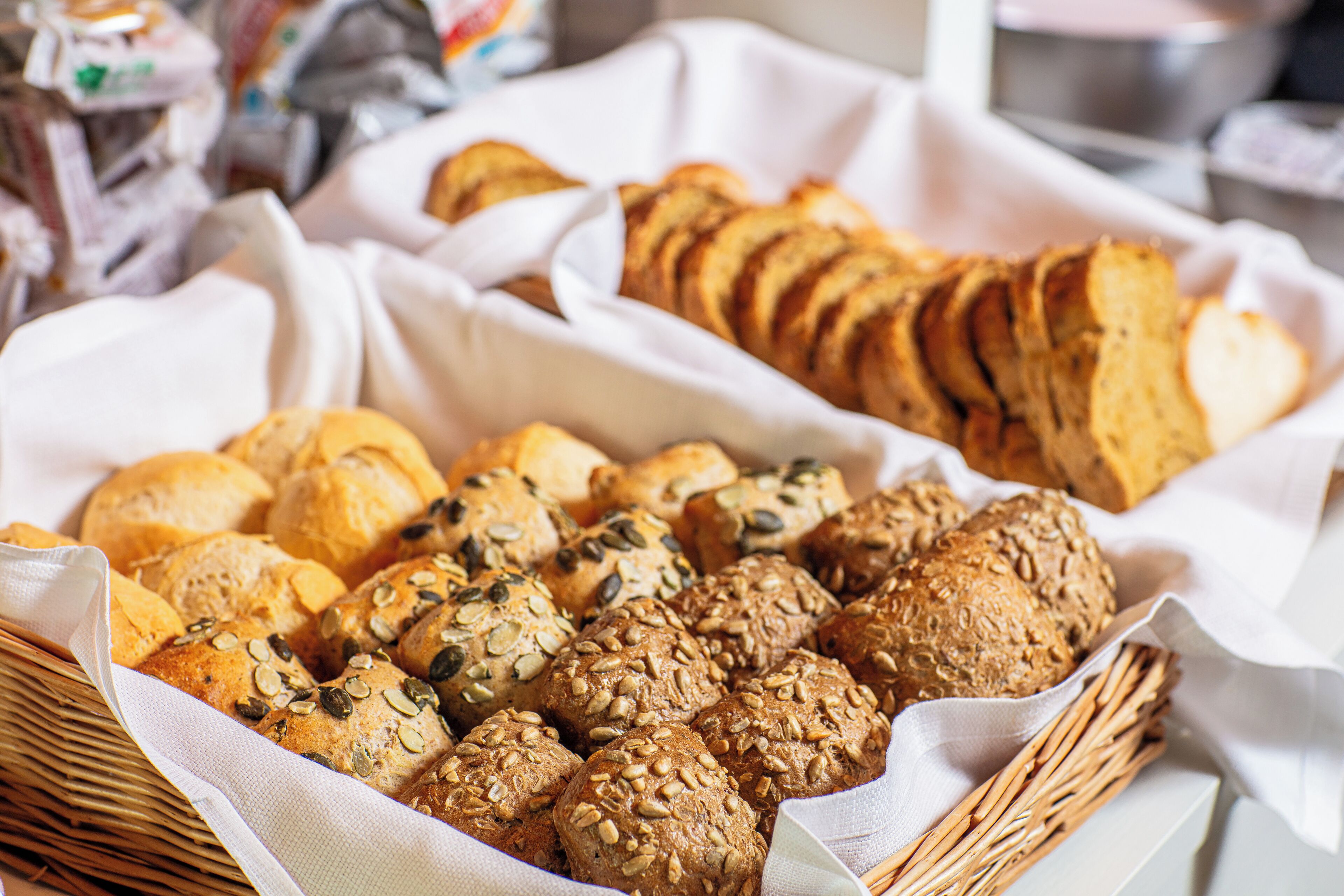 A variety of breads and pastries in a basket.