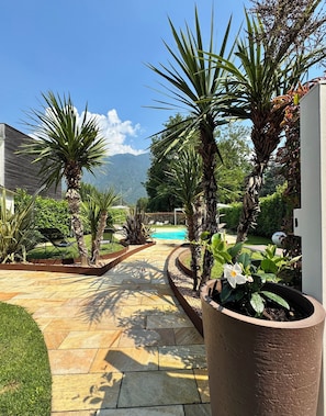 Seasonal outdoor pool, open 9:00 AM to 9:00 PM, pool umbrellas