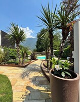 Seasonal outdoor pool, open 9:00 AM to 9:00 PM, pool umbrellas