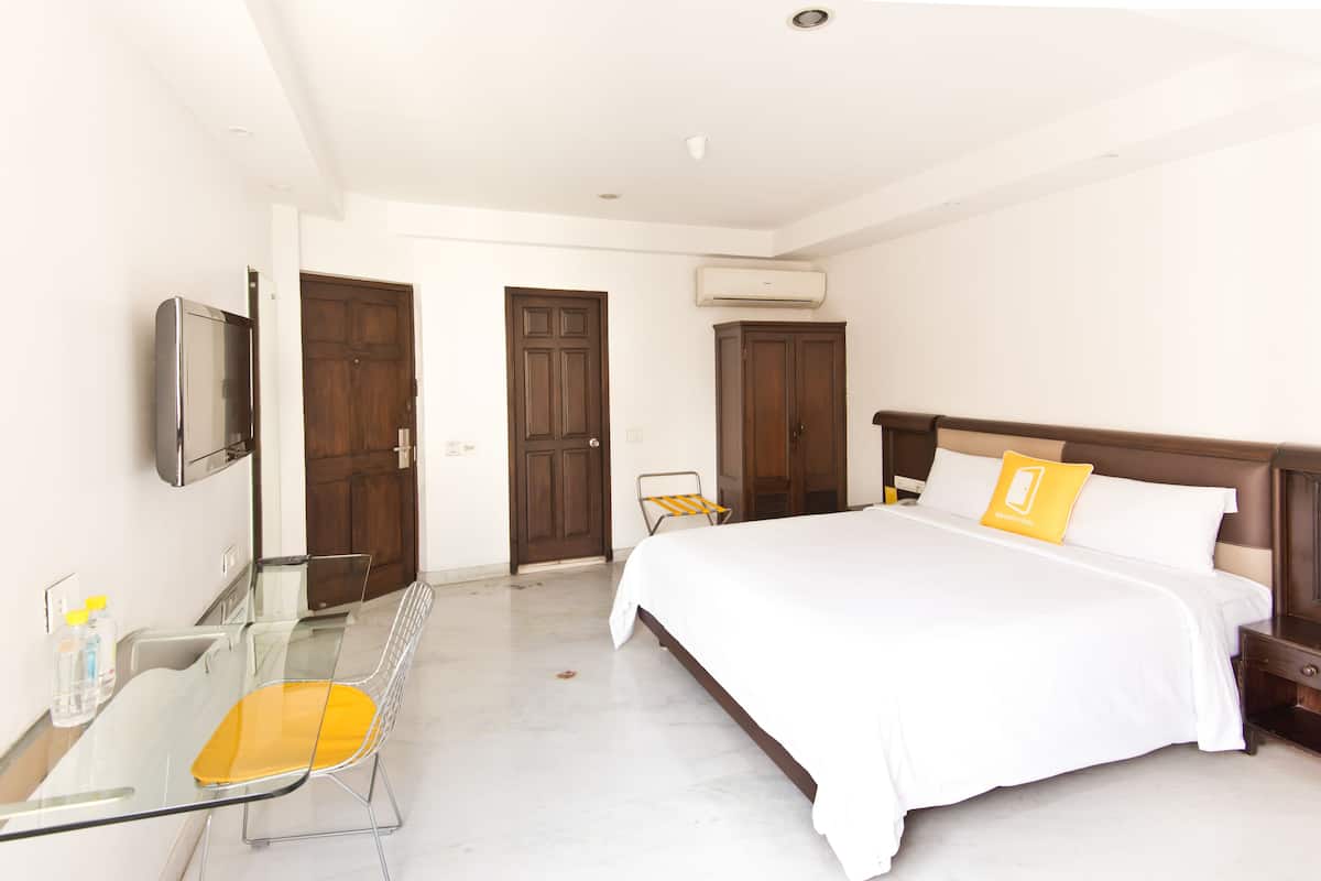 Habitación superior, 1 cama King size | Ropa de cama de alta calidad y caja de seguridad en la habitación