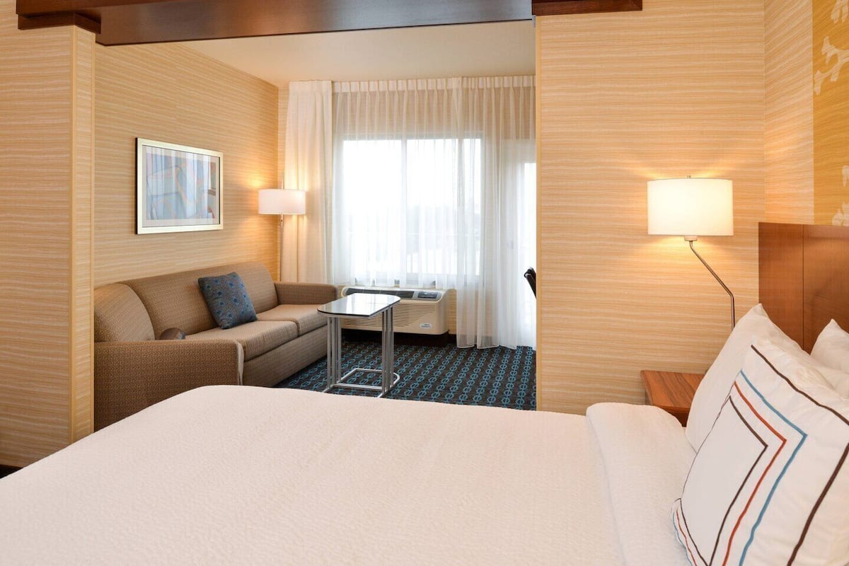 premium bedding, desk, laptop workspace, blackout curtains