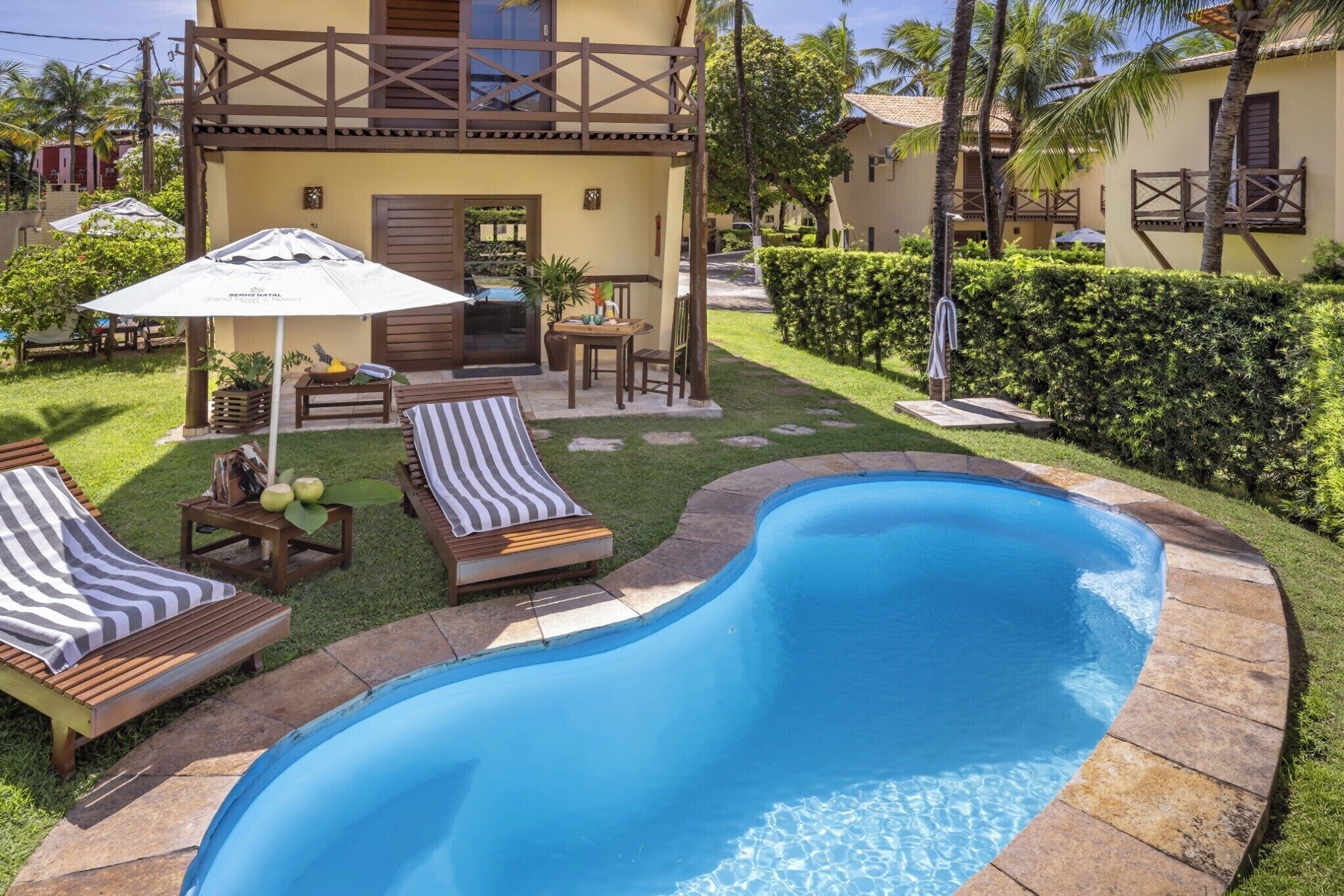 outdoor pool, pool umbrellas, pool loungers