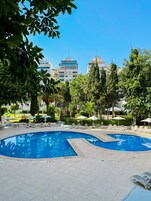 Seasonal outdoor pool, open 10 AM to 6 PM, pool umbrellas, sun loungers