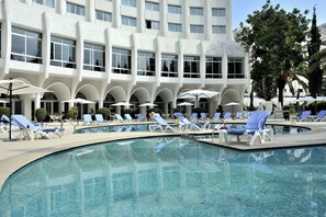 Seasonal outdoor pool, open 10 AM to 6 PM, pool umbrellas, pool loungers