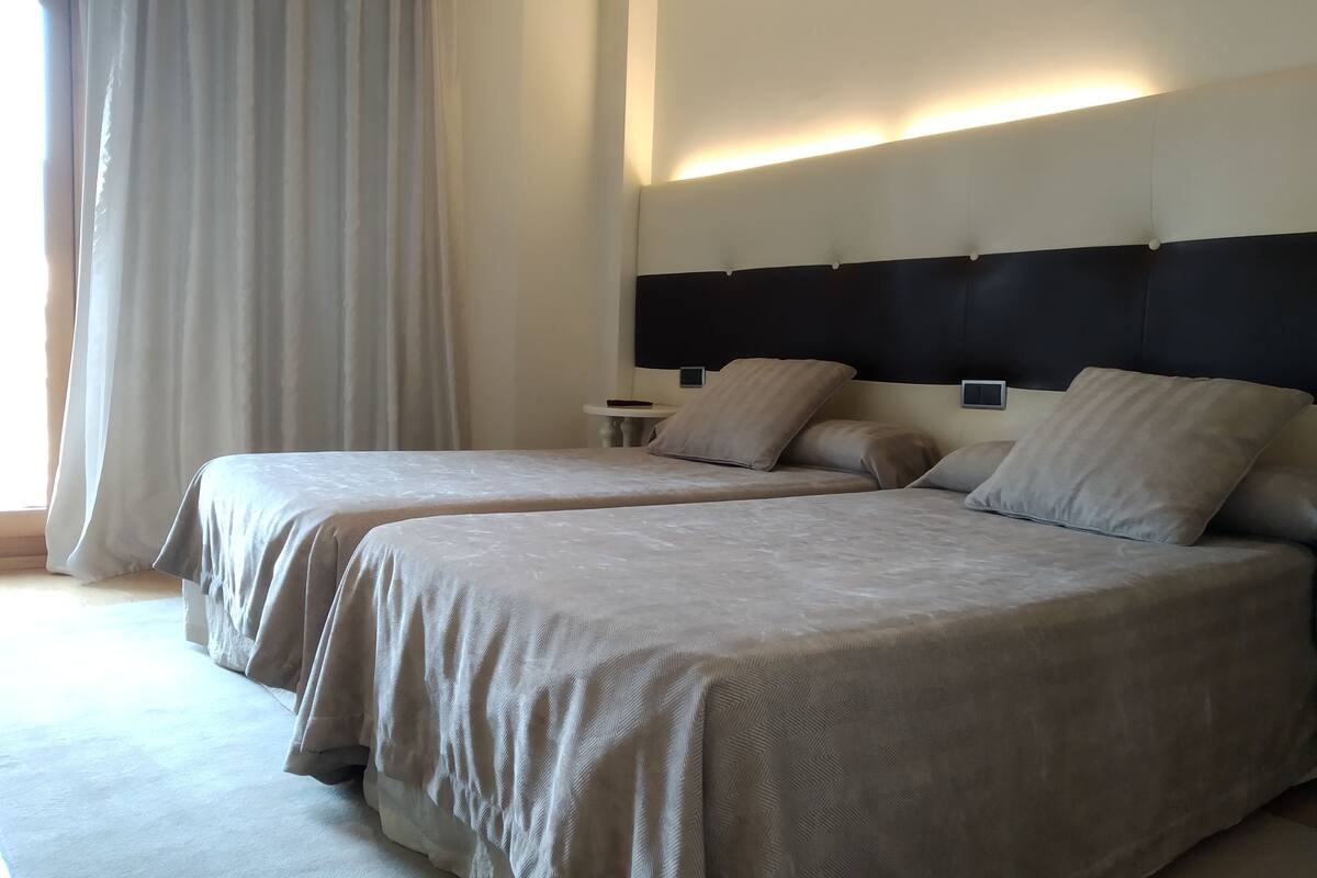 premium bedding, down duvets, minibar, in-room safe