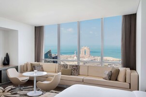 King Junior Suite With Sea View | Living area | 42-cm LED TV with cable channels, TV, iPod dock
