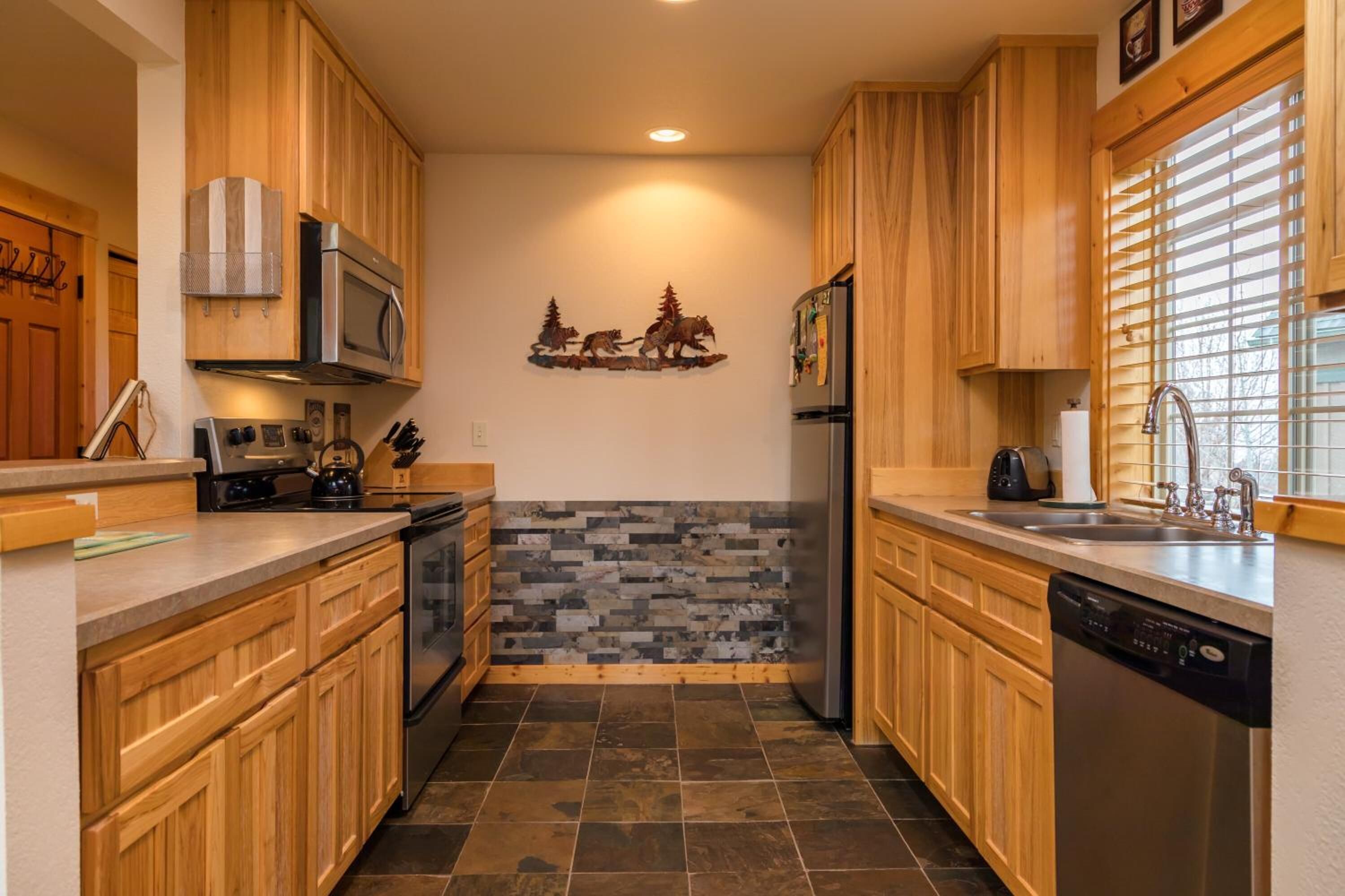 full-sized fridge, microwave, stovetop, dishwasher