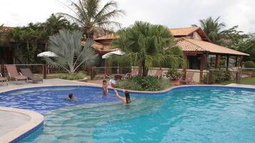 Outdoor pool, open 7 AM to 10 PM, pool loungers