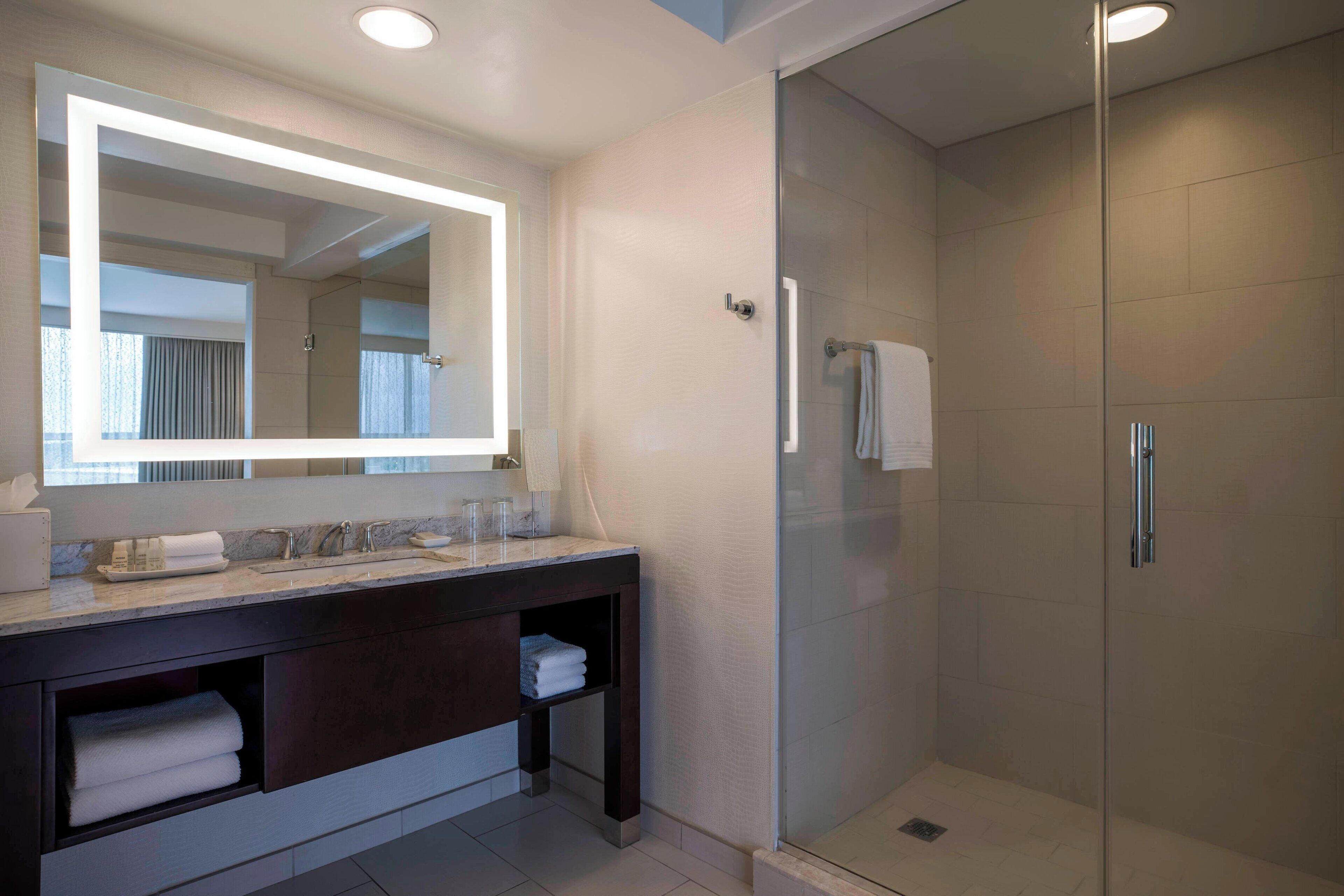 designer toiletries, hair dryer, bathrobes, towels