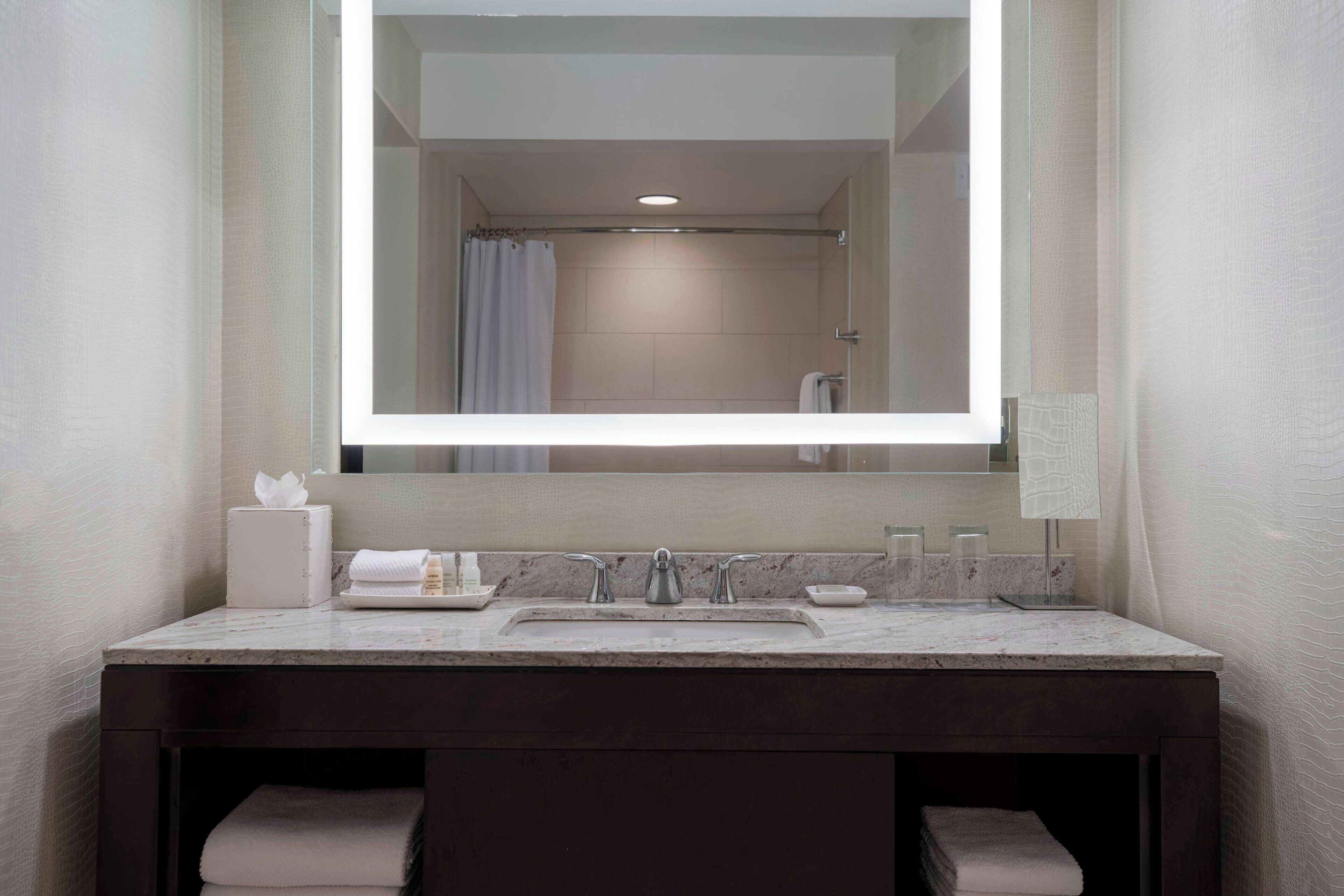 designer toiletries, hair dryer, bathrobes, towels