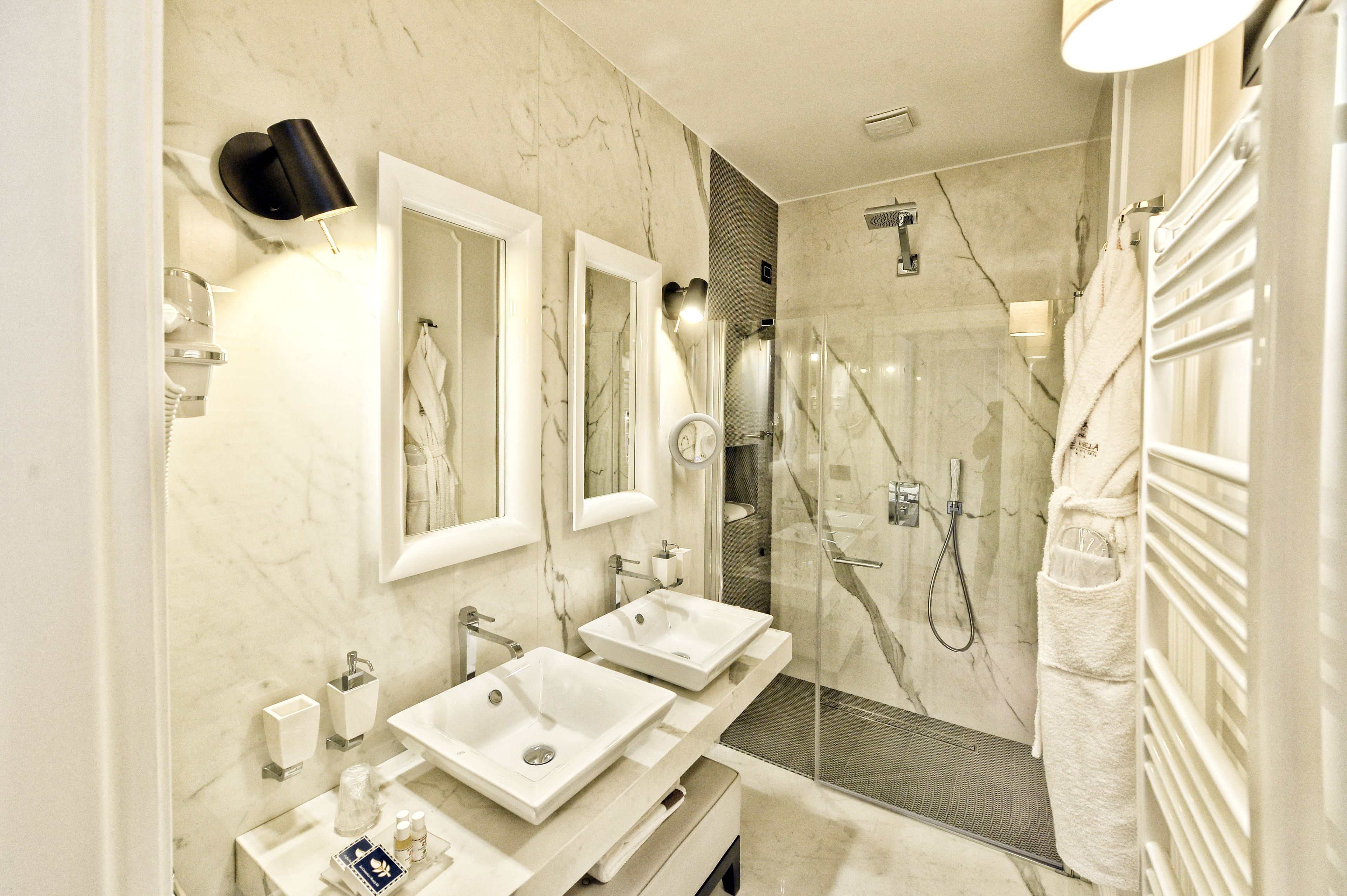 premium studio suite, 1 king bed | bathroom | shower, rainfall showerhead, free toiletries, hair dryer