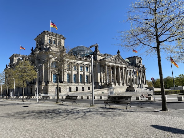 A historic building with classical architecture, featuring columns and a dome.