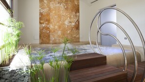 A spa area with a hot tub, wooden steps, and metal railings. - Hotel Il Villino (Santarcangelo di Romagna)