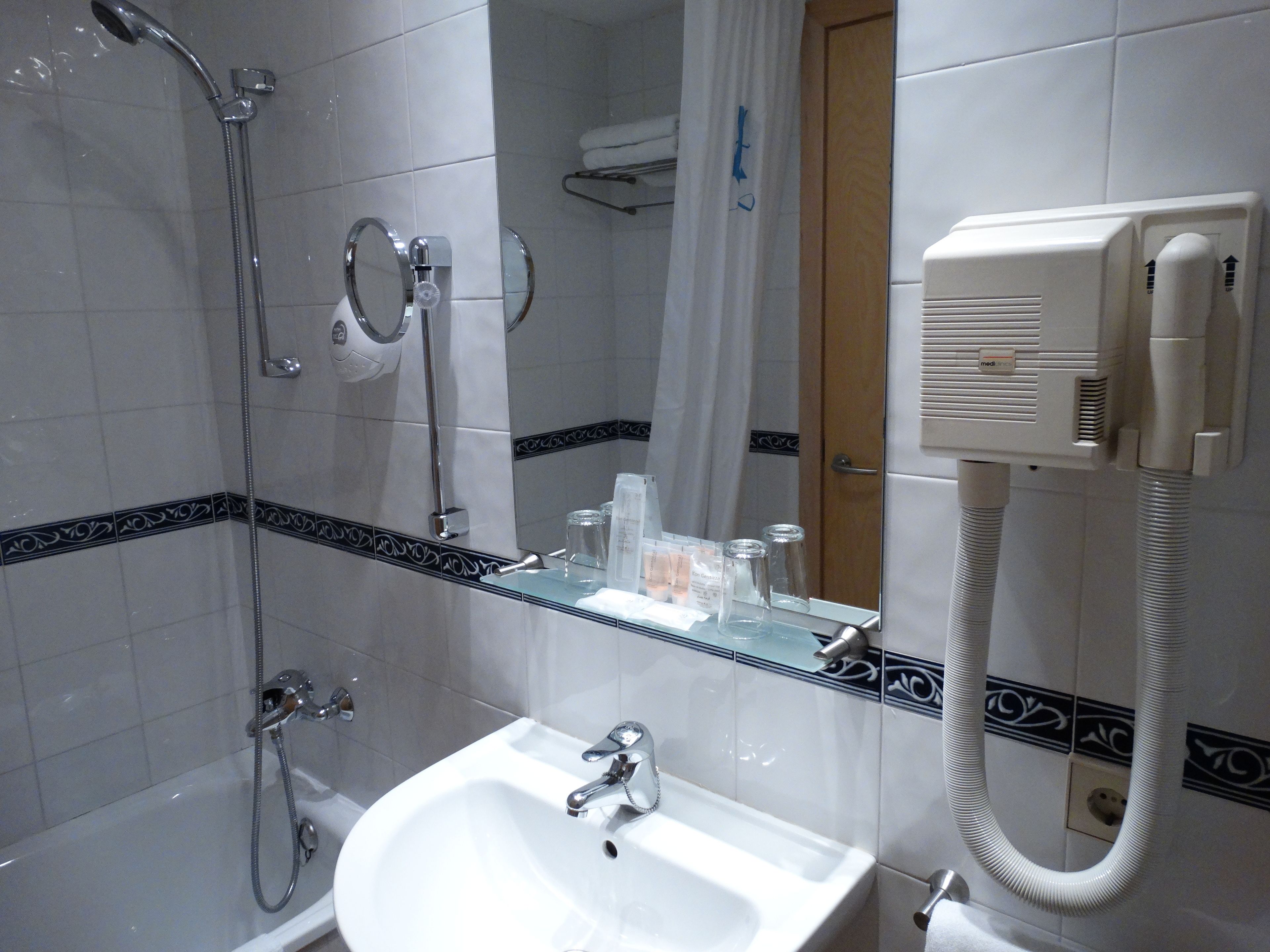 combined shower/bathtub, free toiletries, hair dryer, towels