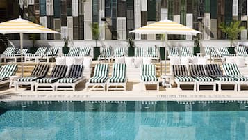 Seasonal outdoor pool, open 10:00 AM to 6:30 PM, pool umbrellas