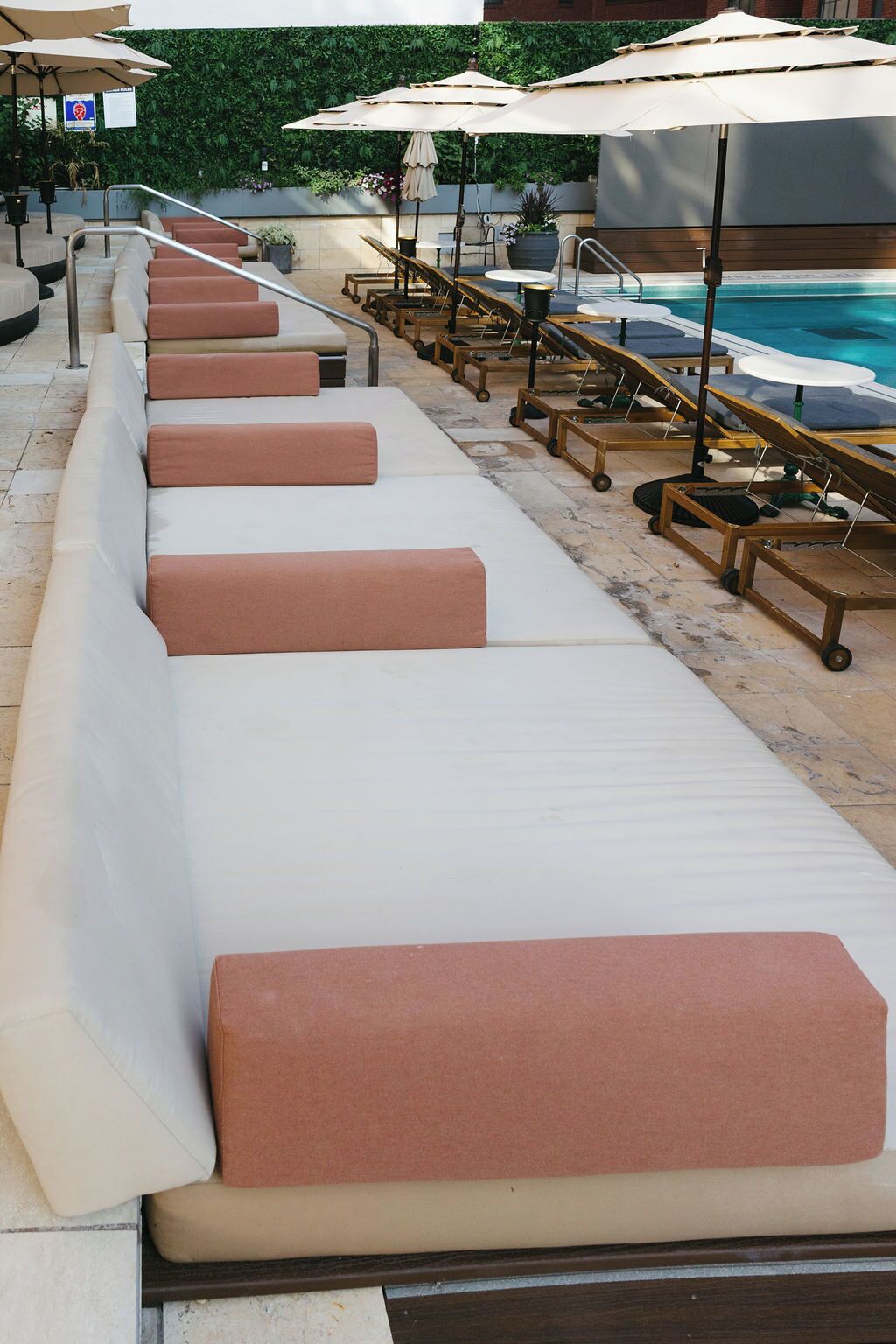 Seasonal outdoor pool, open 10:00 AM to 6:30 PM, pool umbrellas