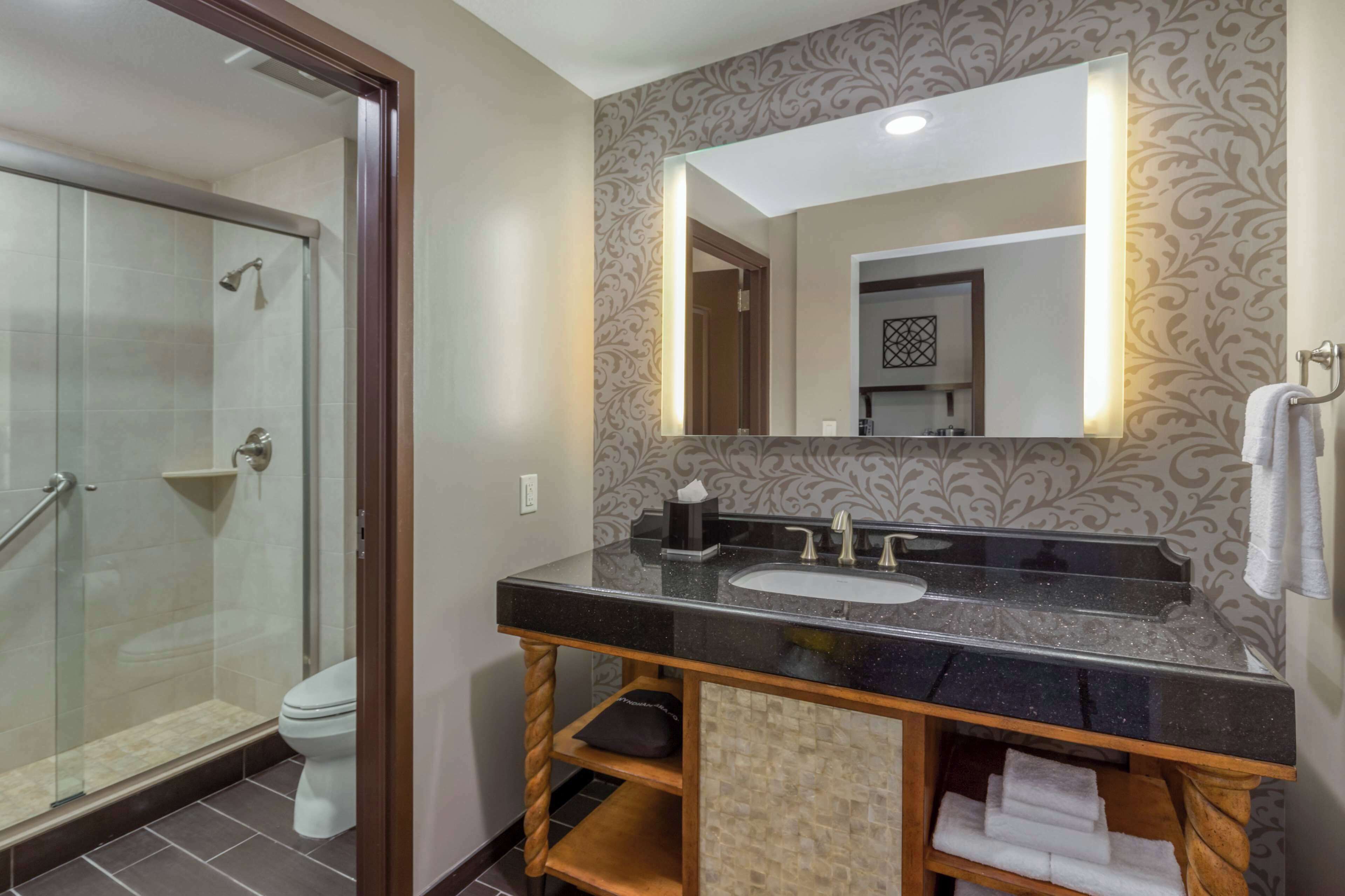 combined shower/bathtub, designer toiletries, hair dryer, bathrobes