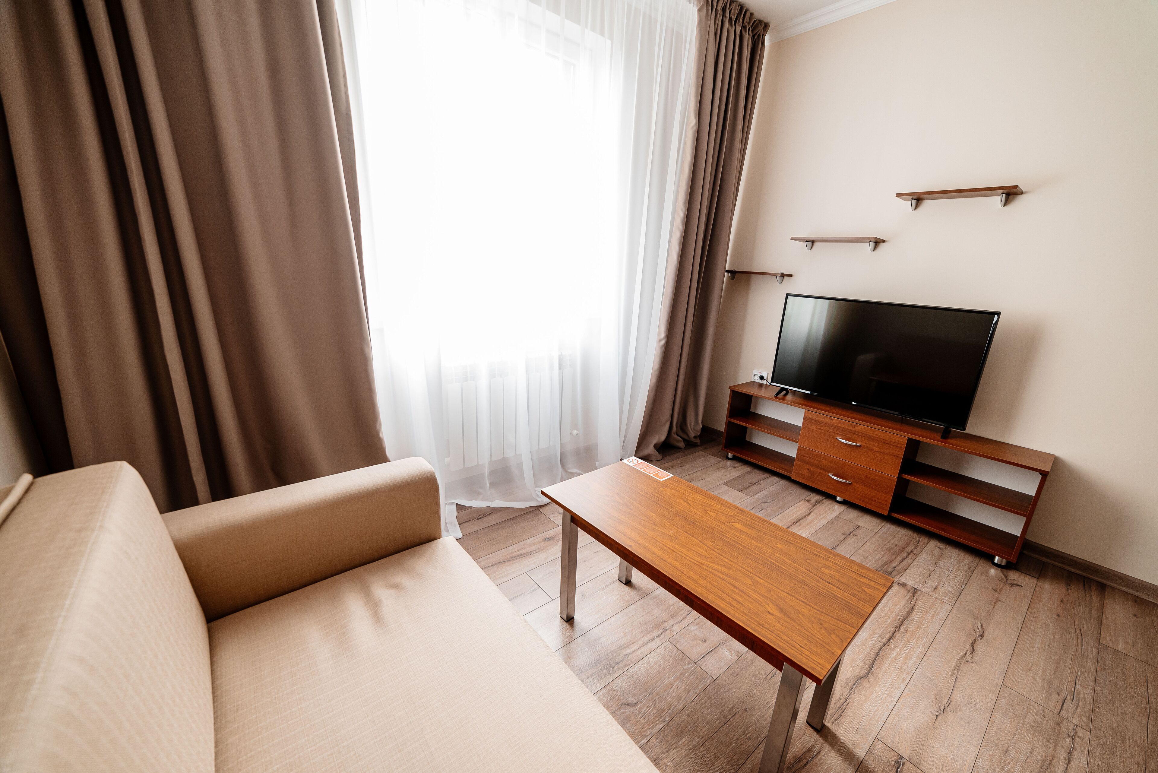 Superior Apartment | Living area | 45-inch plasma TV with satellite channels, TV