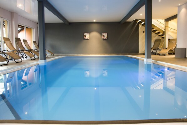 Indoor pool, open 7 AM to 7 PM, pool loungers