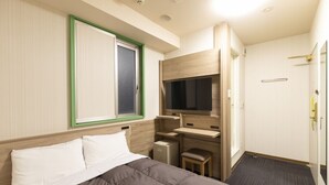 A hotel room with a bed, a desk, a television, and a small cabinet. - Washington R&B Hotel Higashinihombashi (Tokyo)