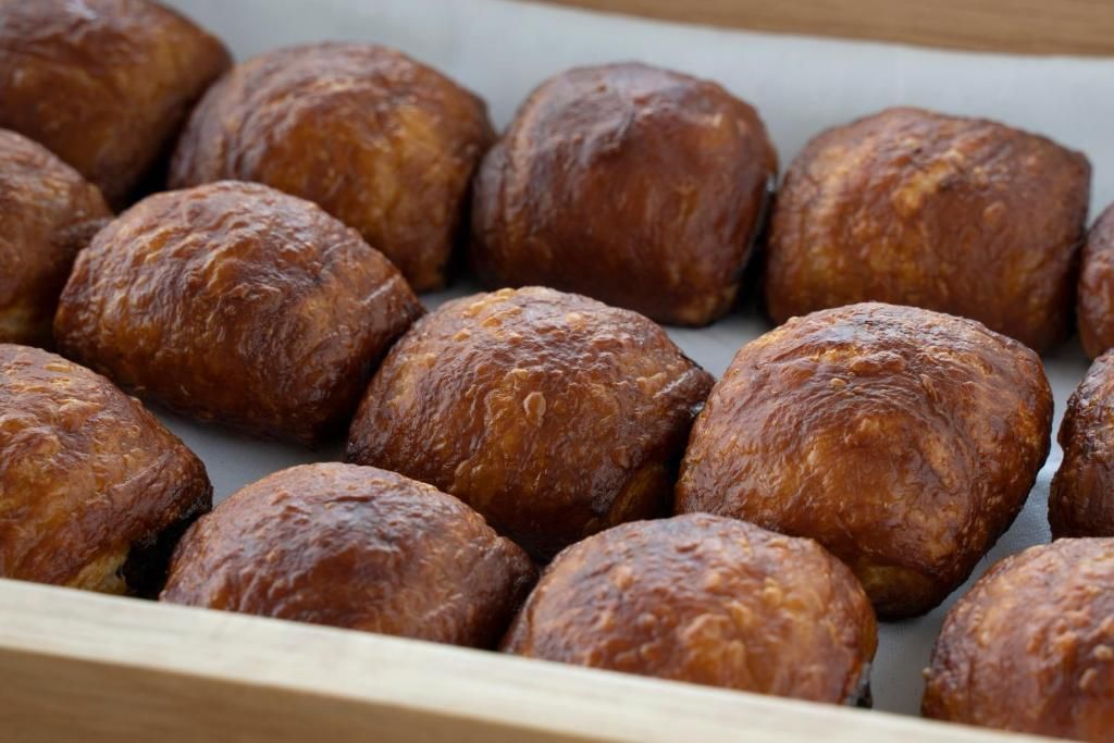 A tray of round, brown pastries.