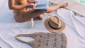 Beach nearby, white sand, beach towels, beach massages