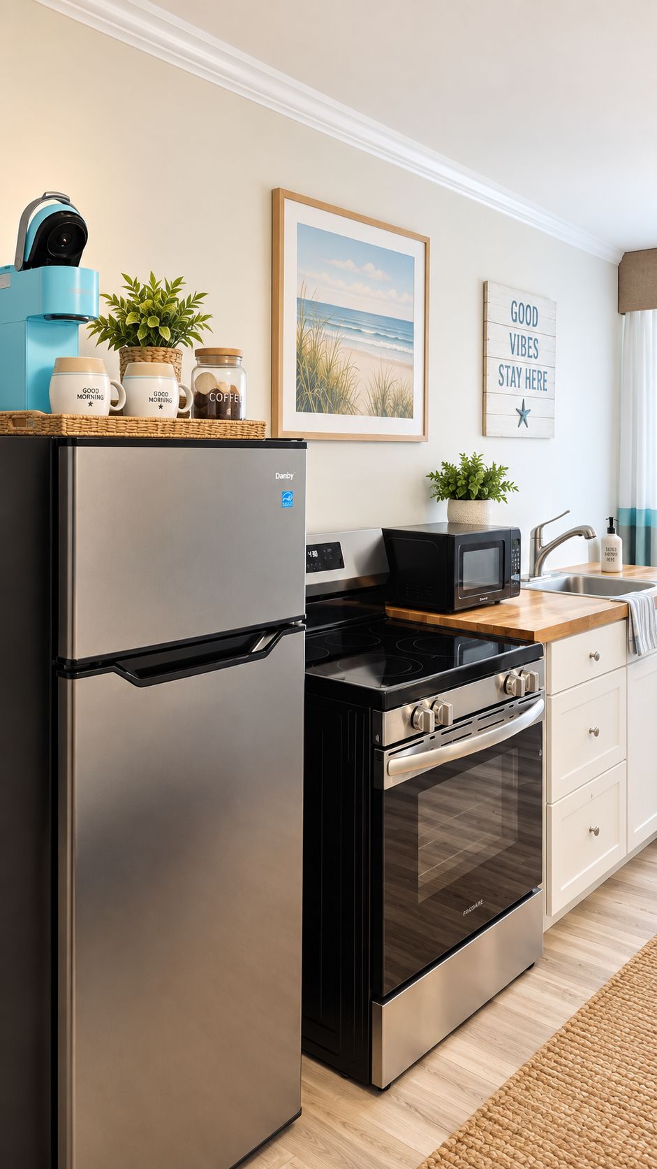 A modern kitchen with a stainless steel refrigerator, a black stove, and a microwave. There is a wooden countertop, a sink, and a potted plant.