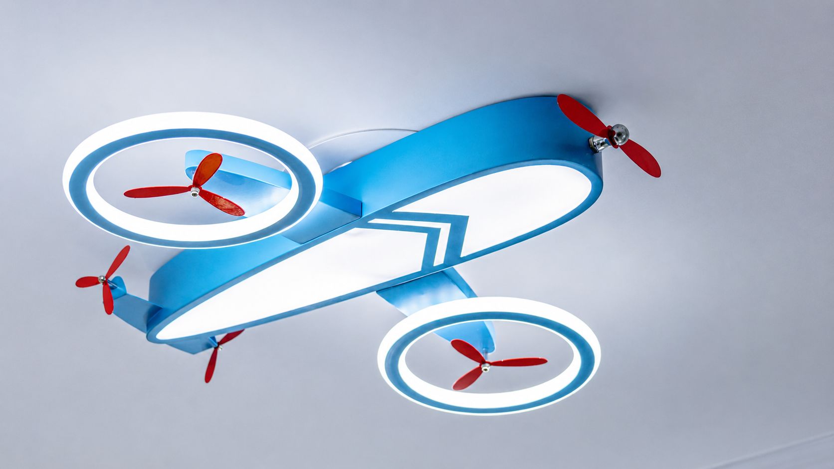 A stylized airplane with four propellers and a blue and white color scheme.