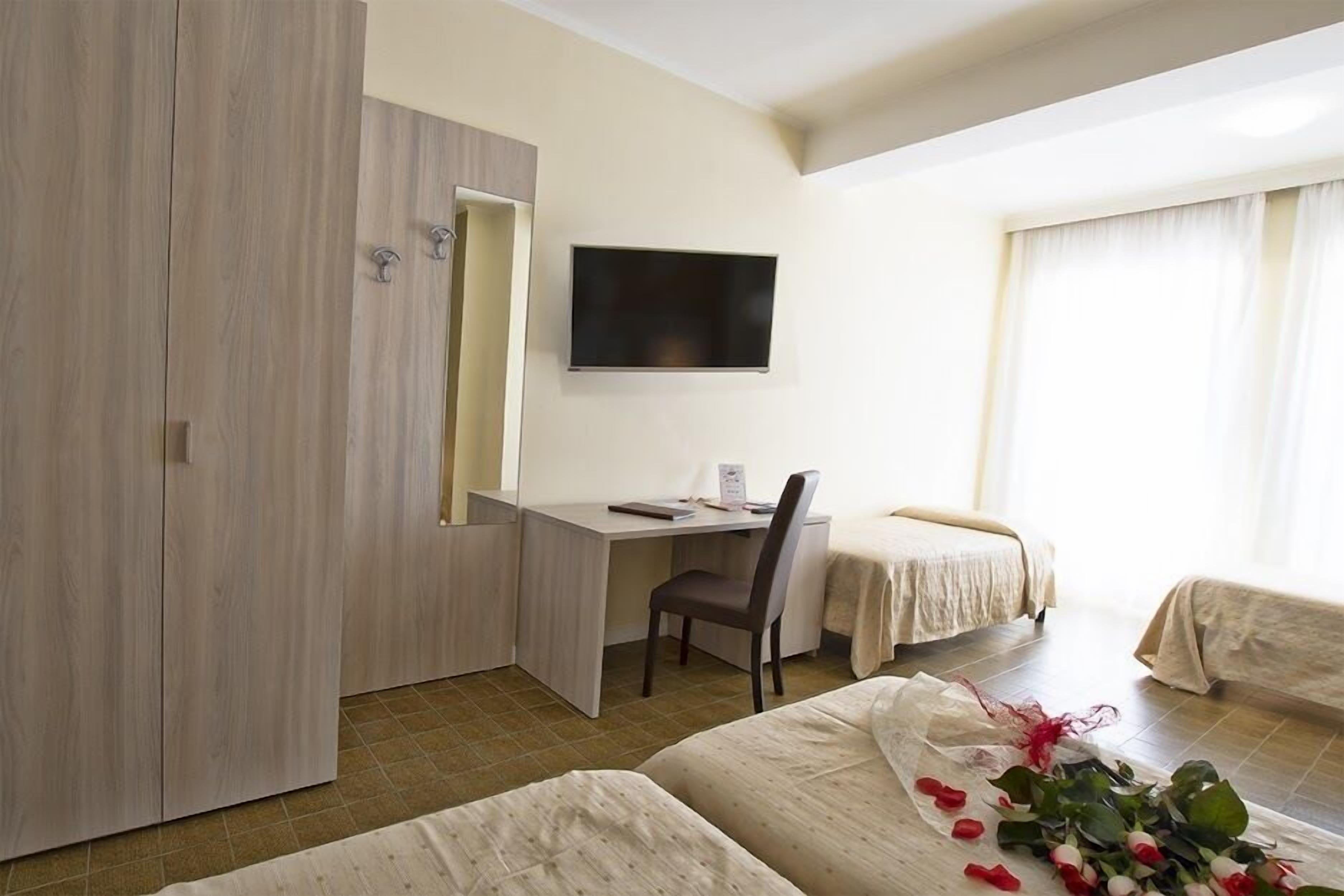 Standard Quadruple Room | Minibar, in-room safe, desk, free WiFi