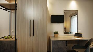 Camas con pillow-top, minibar y caja de seguridad en la habitación