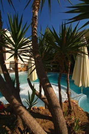 Indoor pool, open 7:30 AM to 7:30 PM, pool umbrellas, pool loungers