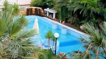 Indoor pool, open 7:30 AM to 7:30 PM, pool umbrellas, sun loungers
