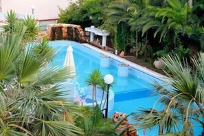 Indoor pool, open 7:30 AM to 7:30 PM, pool umbrellas, sun loungers