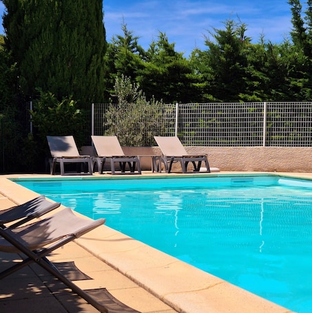 Outdoor pool, open 9:00 AM to 9:00 PM, sun loungers