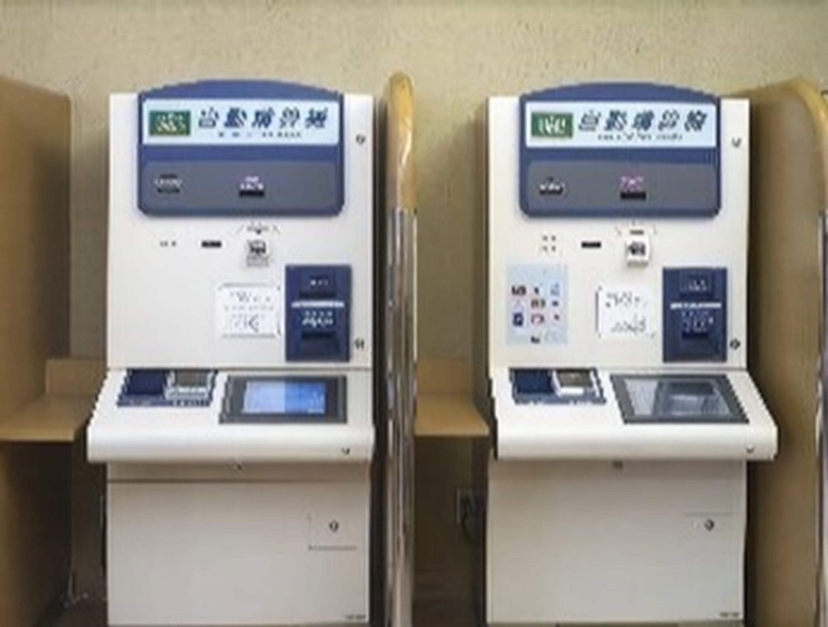 Two ATMs with a keypad, card slot, and display screen.