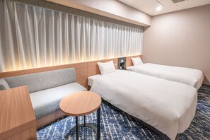 A hotel room with a sofa, two single beds, a small round table, and a large window with curtains. - Washington R&B Hotel Sapporo Kita 3 Nishi 2 (Sapporo)